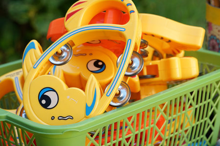 Childrens musical instruments in a basketの写真素材