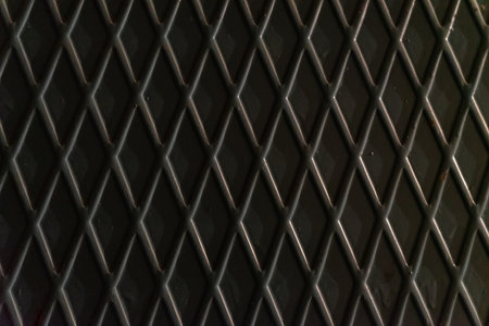The texture of a metal sheet with diamond-shaped corrugationの写真素材