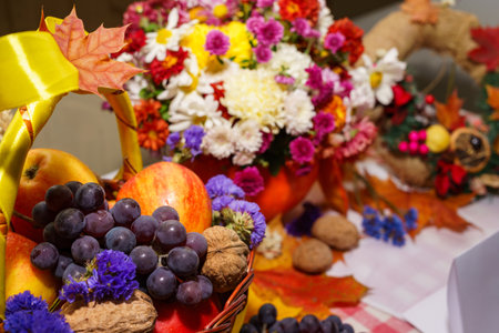 Composition of fruits, flowers and nuts in a basketの写真素材