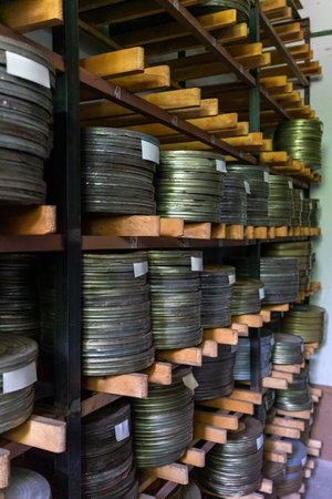 Film reels stored on shelves in a vintage archive roomの写真素材
