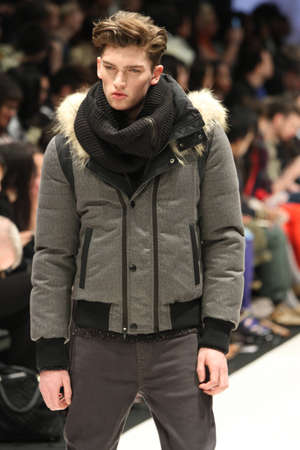 TORONTO - MARCH 13: A model walks the runway in the Soia & Kyo runway show for the Fall/Winter 2012 season at Toronto's World Mastercard Fashion Week on March 13th 2012.のeditorial素材