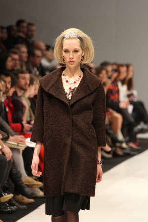 TORONTO - MARCH 13: A model walks the runway in the Lundstrom Collection runway show for the Fall/Winter 2012 season at Toronto's World Mastercard Fashion Week on March 13th 2012.のeditorial素材