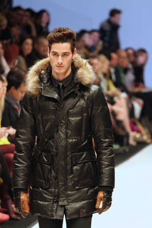 TORONTO - MARCH 15: A model walks the runway in the Rudsak runway show for the Fall/Winter 2012 season at Toronto's World Mastercard Fashion Week on March 15th 2012.のeditorial素材