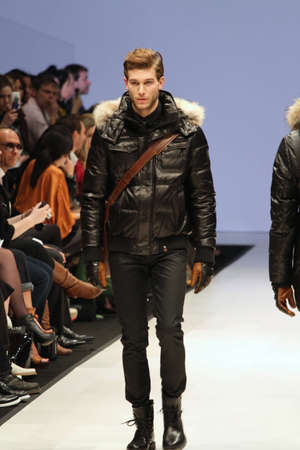 TORONTO - MARCH 15: A model walks the runway in the Rudsak runway show for the Fall/Winter 2012 season at Toronto's World Mastercard Fashion Week on March 15th 2012.のeditorial素材