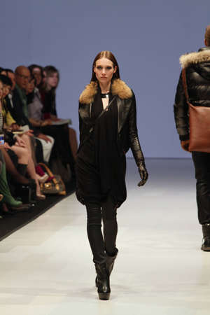 TORONTO - MARCH 15: A model walks the runway in the Rudsak runway show for the Fall/Winter 2012 season at Toronto's World Mastercard Fashion Week on March 15th 2012.のeditorial素材