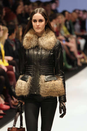 TORONTO - MARCH 15: A model walks the runway in the Rudsak runway show for the Fall/Winter 2012 season at Toronto's World Mastercard Fashion Week on March 15th 2012.のeditorial素材