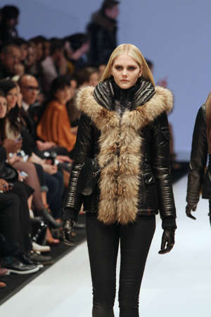 TORONTO - MARCH 15: A model walks the runway in the Rudsak runway show for the Fall/Winter 2012 season at Toronto's World Mastercard Fashion Week on March 15th 2012.のeditorial素材