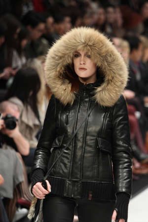 TORONTO - MARCH 15: A model walks the runway in the Rudsak runway show for the Fall/Winter 2012 season at Toronto's World Mastercard Fashion Week on March 15th 2012.のeditorial素材