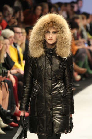 TORONTO - MARCH 15: A model walks the runway in the Rudsak runway show for the Fall/Winter 2012 season at Toronto's World Mastercard Fashion Week on March 15th 2012.のeditorial素材