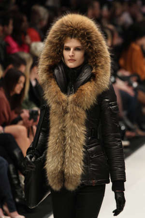 TORONTO - MARCH 15: A model walks the runway in the Rudsak runway show for the Fall/Winter 2012 season at Toronto's World Mastercard Fashion Week on March 15th 2012.のeditorial素材