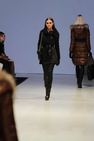 TORONTO - MARCH 15: A model walks the runway in the Rudsak runway show for the Fall/Winter 2012 season at Toronto's World Mastercard Fashion Week on March 15th 2012.のeditorial素材