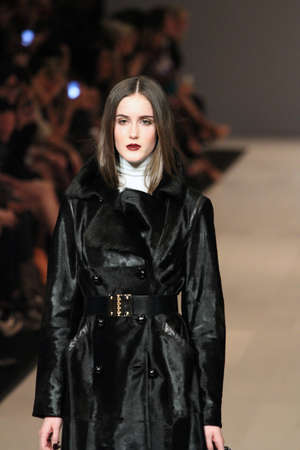 TORONTO - MARCH 15: A model walks the runway in the Pink Tartan runway show for the Fall/Winter 2012 season at Toronto's World Mastercard Fashion Week on March 15th 2012.のeditorial素材