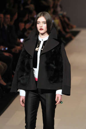 TORONTO - MARCH 15: A model walks the runway in the Pink Tartan runway show for the Fall/Winter 2012 season at Toronto's World Mastercard Fashion Week on March 15th 2012.のeditorial素材