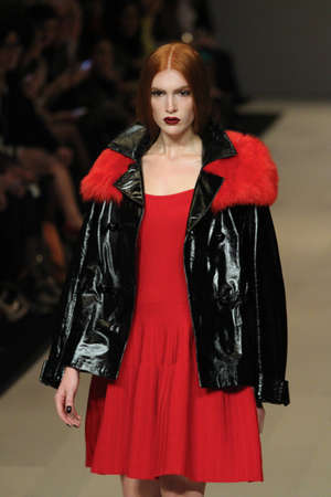 TORONTO - MARCH 15: A model walks the runway in the Pink Tartan runway show for the Fall/Winter 2012 season at Toronto's World Mastercard Fashion Week on March 15th 2012.のeditorial素材