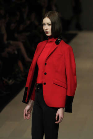 TORONTO - MARCH 15: A model walks the runway in the Pink Tartan runway show for the Fall/Winter 2012 season at Toronto's World Mastercard Fashion Week on March 15th 2012.のeditorial素材