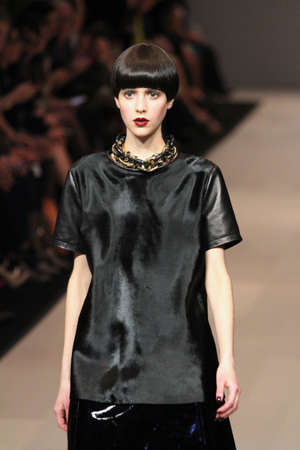 TORONTO - MARCH 15: A model walks the runway in the Pink Tartan runway show for the Fall/Winter 2012 season at Toronto's World Mastercard Fashion Week on March 15th 2012.のeditorial素材