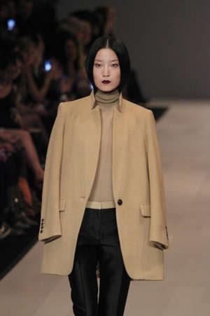 TORONTO - MARCH 15: A model walks the runway in the Pink Tartan runway show for the Fall/Winter 2012 season at Toronto's World Mastercard Fashion Week on March 15th 2012.のeditorial素材