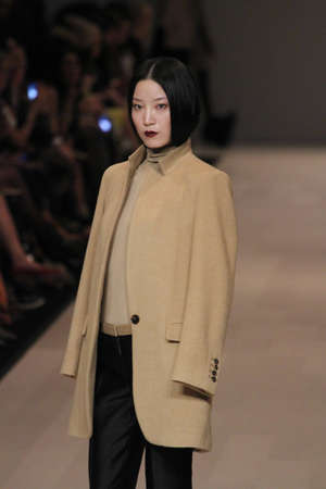 TORONTO - MARCH 15: A model walks the runway in the Pink Tartan runway show for the Fall/Winter 2012 season at Toronto's World Mastercard Fashion Week on March 15th 2012.のeditorial素材