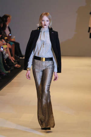 TORONTO - MARCH 15: A model walks the runway in the Pink Tartan runway show for the Fall/Winter 2012 season at Toronto's World Mastercard Fashion Week on March 15th 2012.のeditorial素材