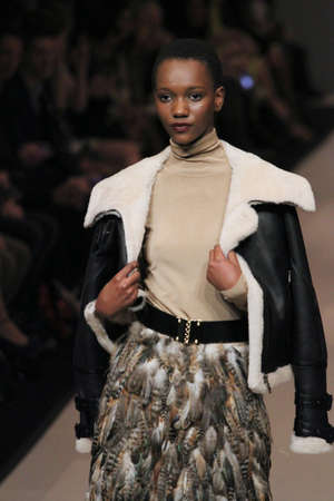 TORONTO - MARCH 15: A model walks the runway in the Pink Tartan runway show for the Fall/Winter 2012 season at Toronto's World Mastercard Fashion Week on March 15th 2012.のeditorial素材