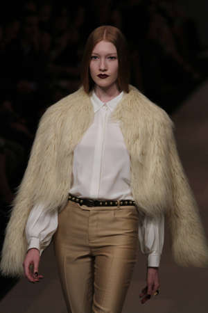 TORONTO - MARCH 15: A model walks the runway in the Pink Tartan runway show for the Fall/Winter 2012 season at Toronto's World Mastercard Fashion Week on March 15th 2012.のeditorial素材