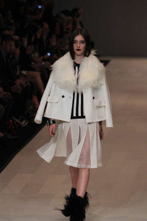 TORONTO - MARCH 15: A model walks the runway in the Pink Tartan runway show for the Fall/Winter 2012 season at Toronto's World Mastercard Fashion Week on March 15th 2012.のeditorial素材