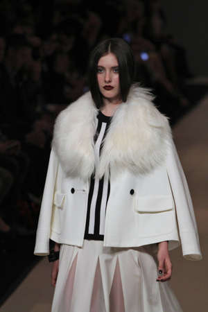TORONTO - MARCH 15: A model walks the runway in the Pink Tartan runway show for the Fall/Winter 2012 season at Toronto's World Mastercard Fashion Week on March 15th 2012.のeditorial素材