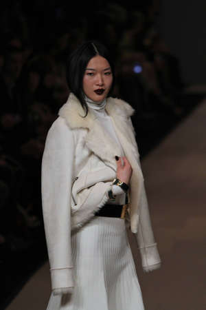 TORONTO - MARCH 15: A model walks the runway in the Pink Tartan runway show for the Fall/Winter 2012 season at Toronto's World Mastercard Fashion Week on March 15th 2012.のeditorial素材