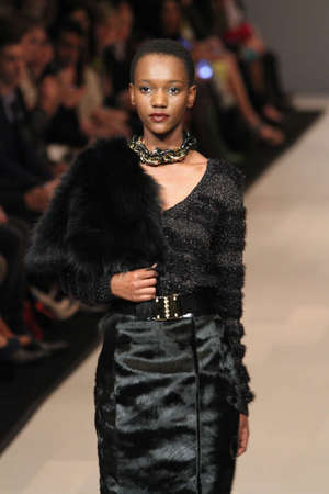 TORONTO - MARCH 15: A model walks the runway in the Pink Tartan runway show for the Fall/Winter 2012 season at Toronto's World Mastercard Fashion Week on March 15th 2012.のeditorial素材