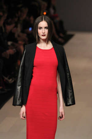 TORONTO - MARCH 15: A model walks the runway in the Pink Tartan runway show for the Fall/Winter 2012 season at Toronto's World Mastercard Fashion Week on March 15th 2012.のeditorial素材