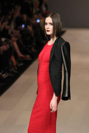 TORONTO - MARCH 15: A model walks the runway in the Pink Tartan runway show for the Fall/Winter 2012 season at Toronto's World Mastercard Fashion Week on March 15th 2012.のeditorial素材