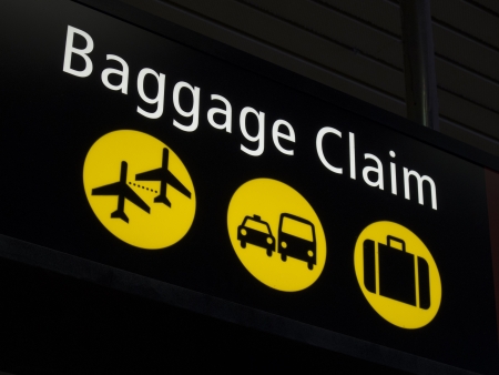 Airport baggage sign directing passengers to various areas of the airportの写真素材