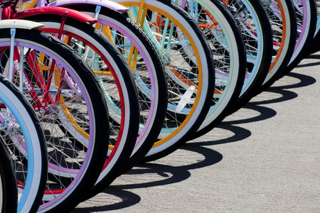Colorful bike wheel parked to make a pattern
