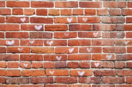 Vintage old red brickwall with a heart patternの写真素材