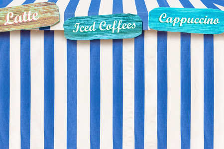 Iced Coffees, Cappuccino, Latte advertised on a circus style tent