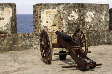 Historic cannon at the ready in old San Juan Puerto Ricoの写真素材