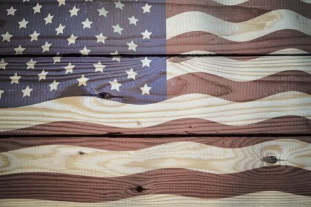 Vintage American Flag painted on aged, weathered rustic wooden Background.