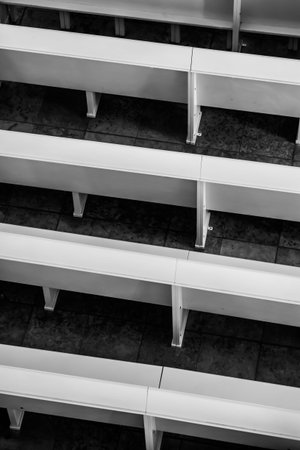 Empty benches in church, black and white