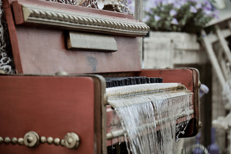 Close-up of vintage piano fountain with dripping water and blurred backgroundの写真素材