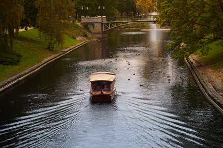 A boat sailing in the park near Latvian National opera and ballet theater in Riga, Latvia.の写真素材