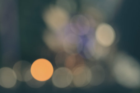 Abstract blue green bokeh background with soft focus christmas lights.