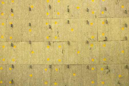 Echo absorber sandwich panel for wall. Background of yellow finishing blocks. Texture.