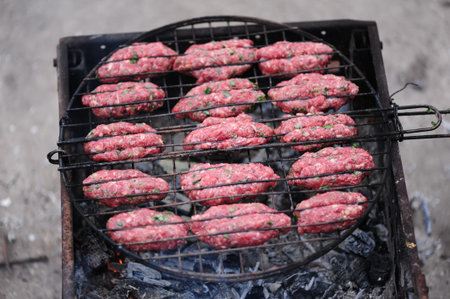luleh kebab on the grill over hot coals, close-up. Nice