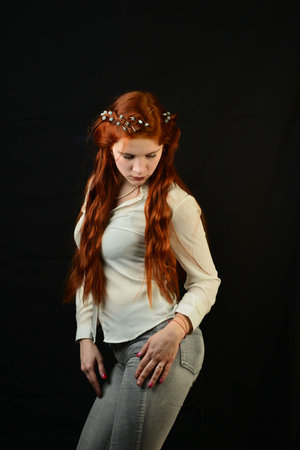 portrait of a beautiful young woman with elegant long red shiny hair, hairstyle.
