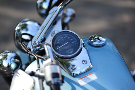 Motorcycle detail with gasoline tank and speedometer. Chrome motorcycle details closeup
