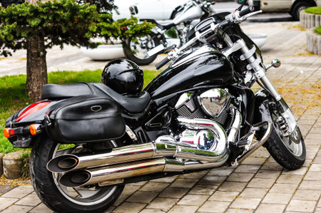 glossy black motorcycle with raindrops.chrome and gloss.