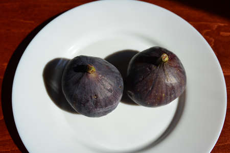 Fresh figs . Beautiful blue violet figs with empty copy space. close upの写真素材