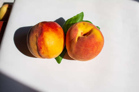 fresh peaches on table. Beautiful red yellow peaches. close upの写真素材
