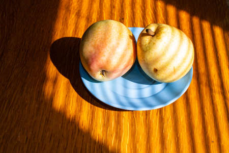 Fresh bio pears on the plate. close up.の写真素材