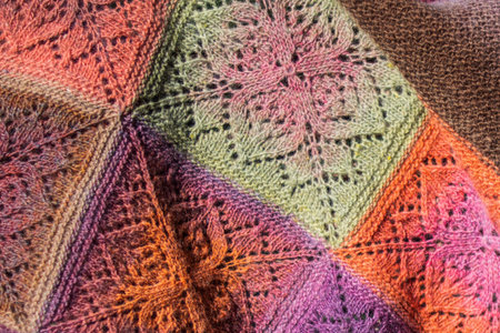 Handmade. Crochet. Woolen thread. Colorful shawl.
